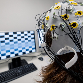 A participant in a study at the electroencephalography (EEG) laboratory of UniDistance Suisse